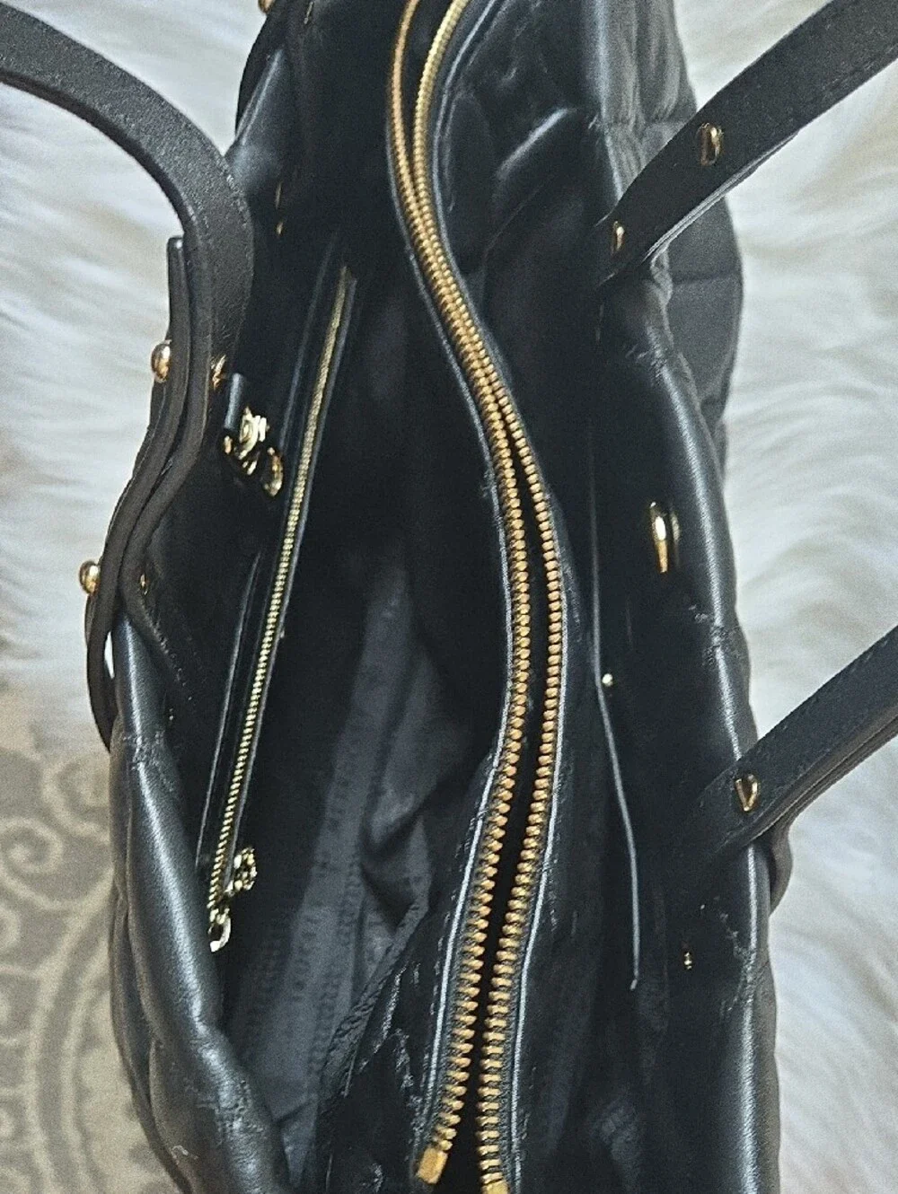 Quilted Black Tote with Gold Medallion Accent
